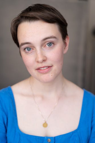 a professional natural light headshot of a London actor