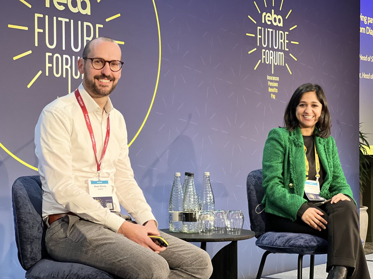 People giving a keynote presentation at a conference.