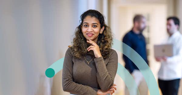 Woman with hand on chin, thinking