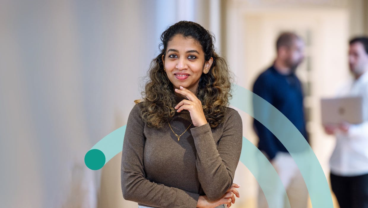 Woman with hand on chin, thinking