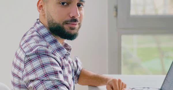 A man turning towards the camera.