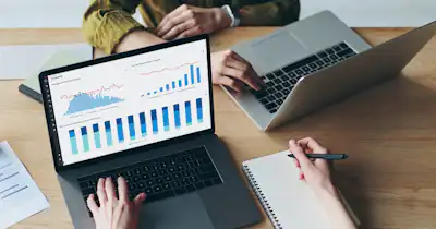 laptop screen with charts and graphs
