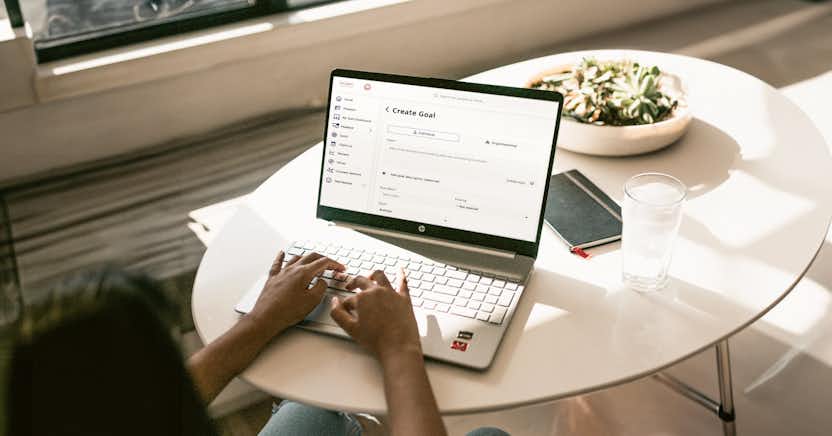 person typing on laptop on table