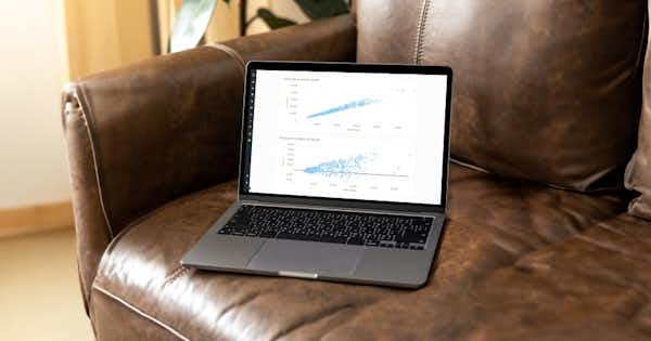 Laptop on table showing charts