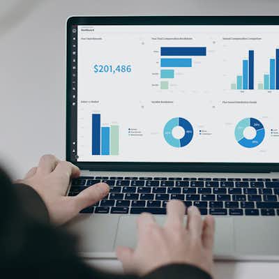 Person at computer with a graphical dashboard