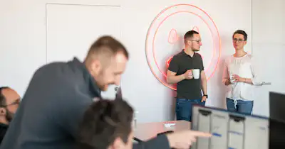 Employees in various poses in office