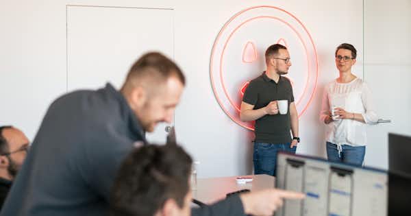 Employees in various poses in office