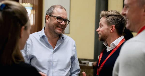 Executive and employees talking together