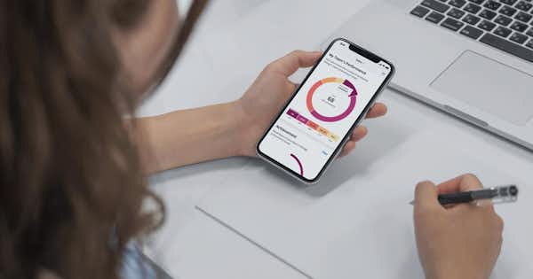 Woman looking at information on her mobile phone