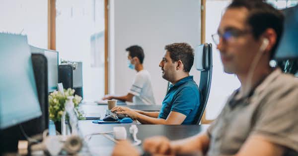 Employees at their workstations