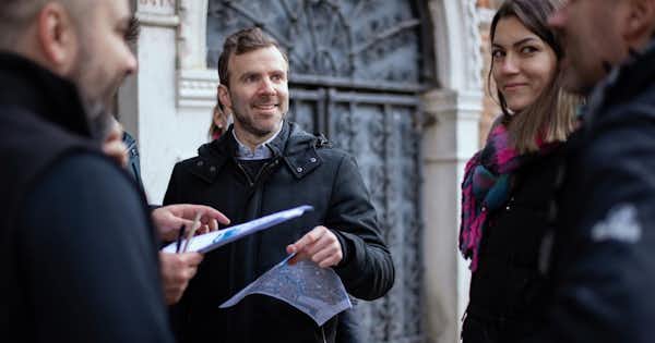 A small group of employees talking together outside