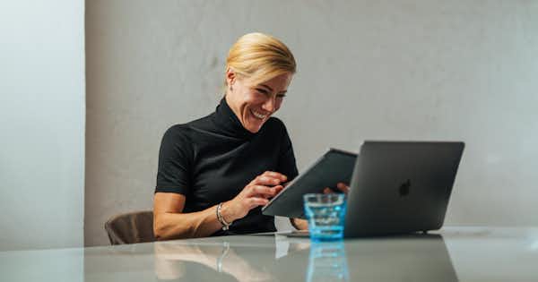 Smiling woman at computer