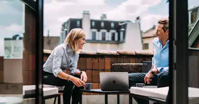 Woman and man talking in an outdoor setting