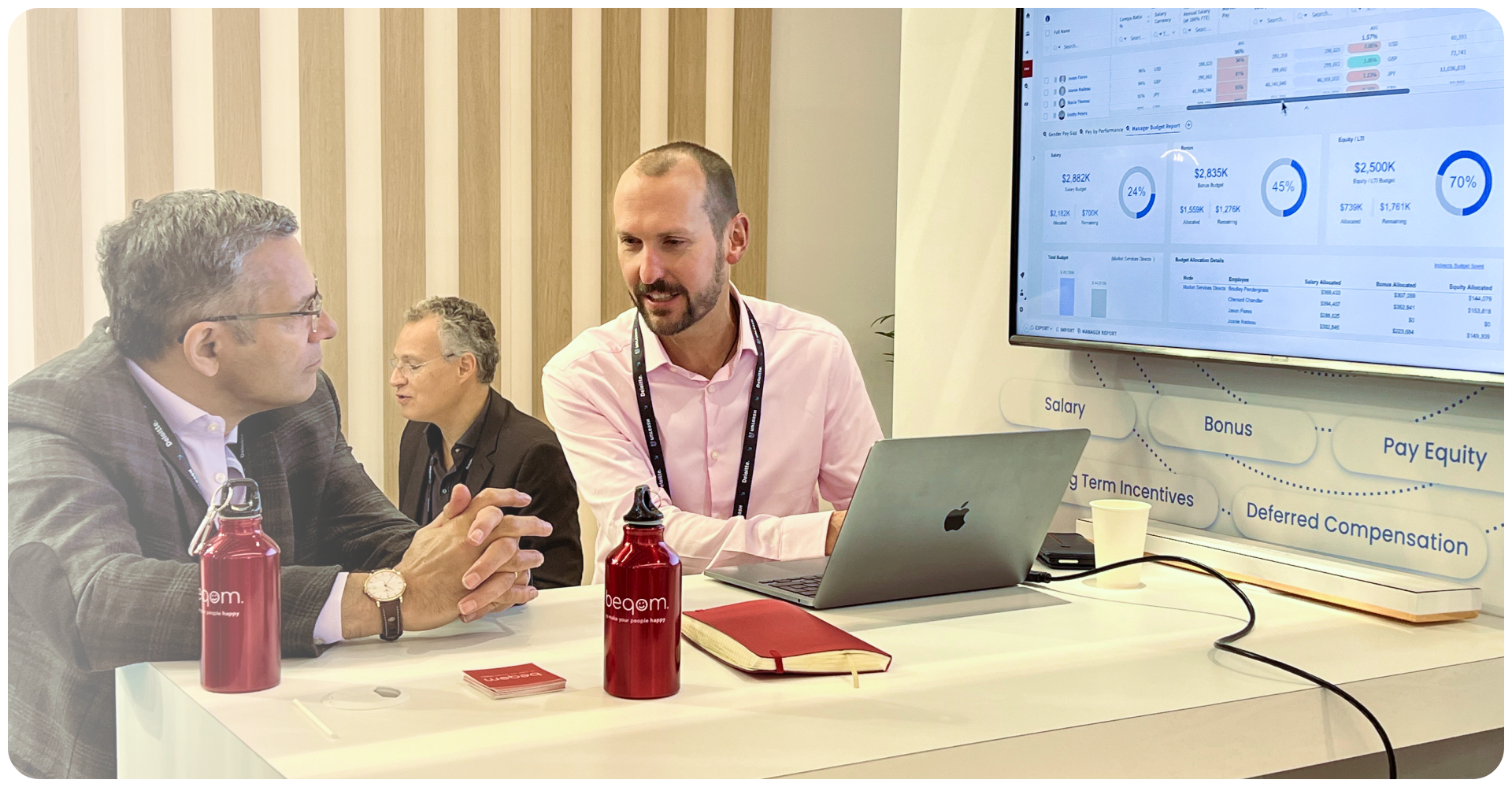 Two men talking at a conference.
