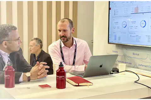 Two men talking at a conference.