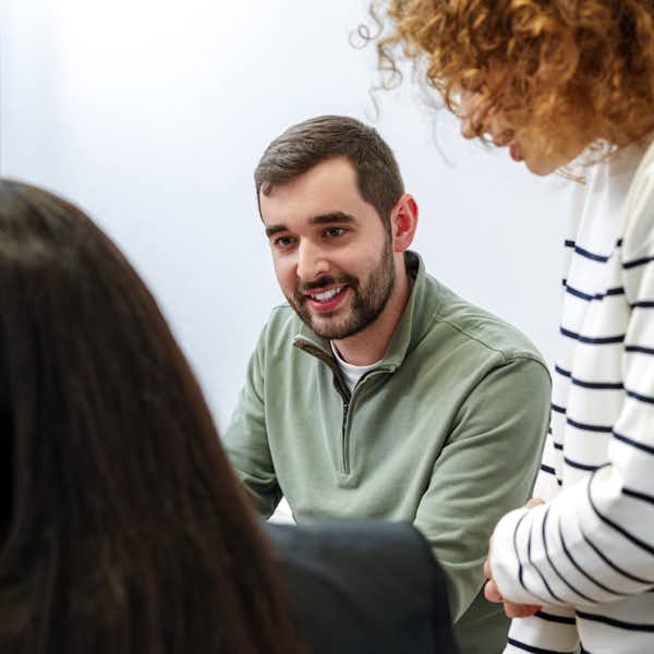 A photograph of a man in an office
