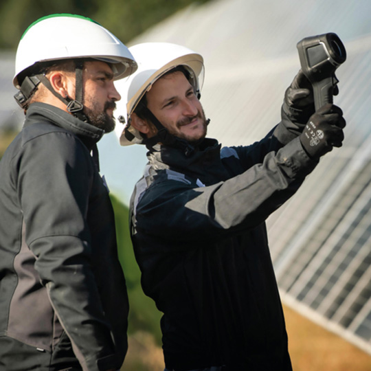 Two men with white hard-hats.