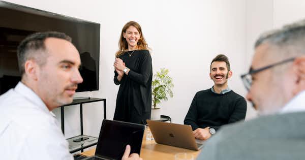 four people in an office setting