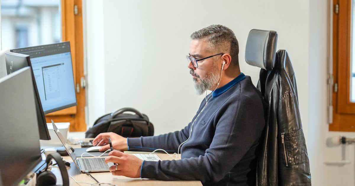 focused male worker on the computer