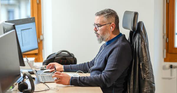 focused male worker on the computer