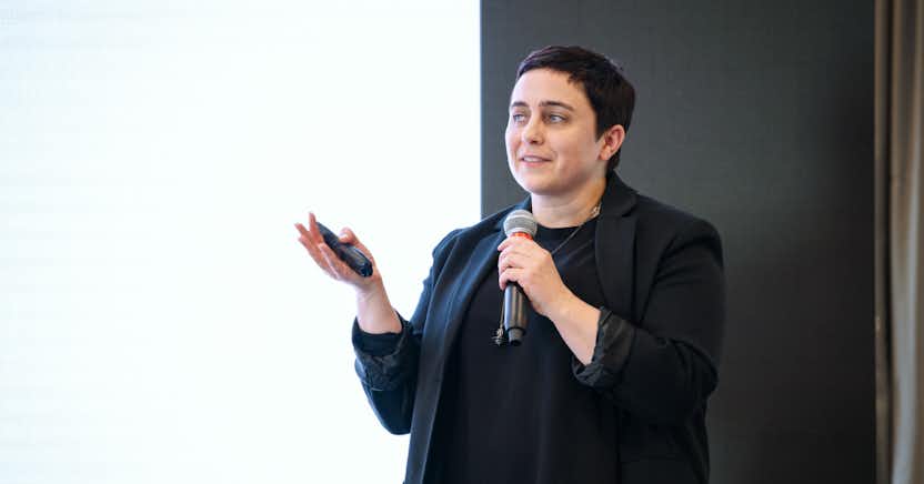 A person with a microphone on stage.