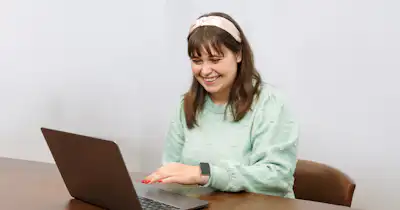 Woman sitting at desk with computer