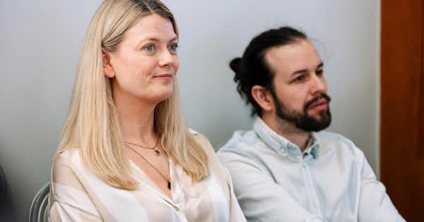 A photo of a man and a woman sitting together.