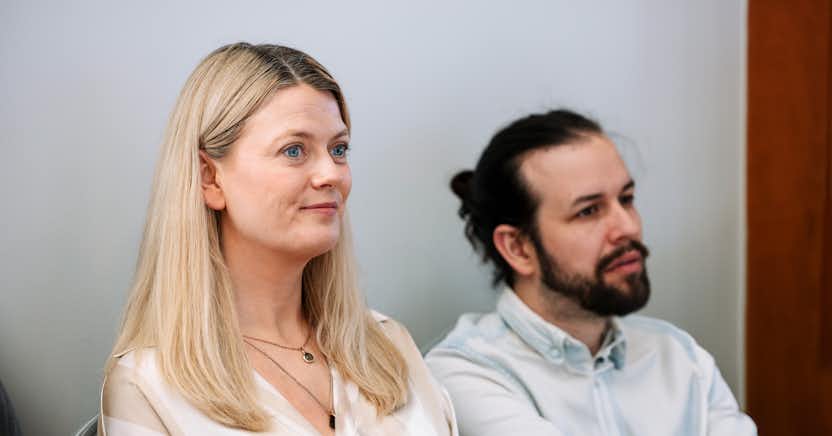 A photo of a man and a woman sitting together.