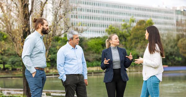 4 people having a discussion.