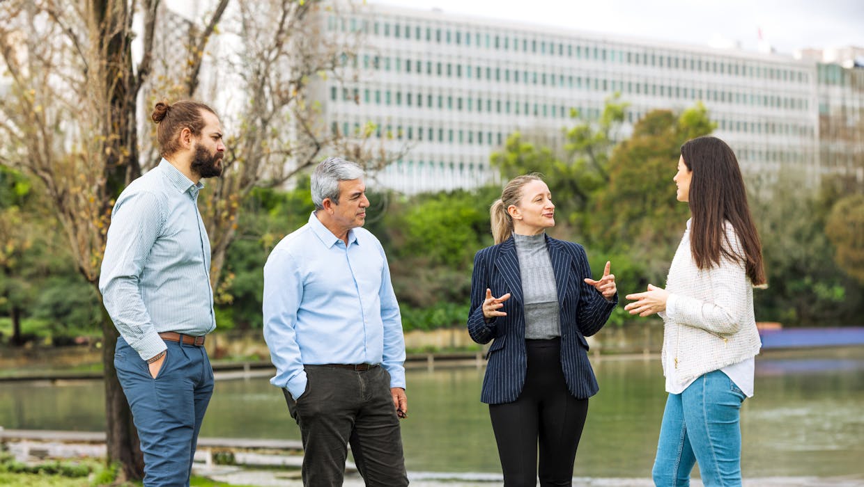 4 people having a discussion.