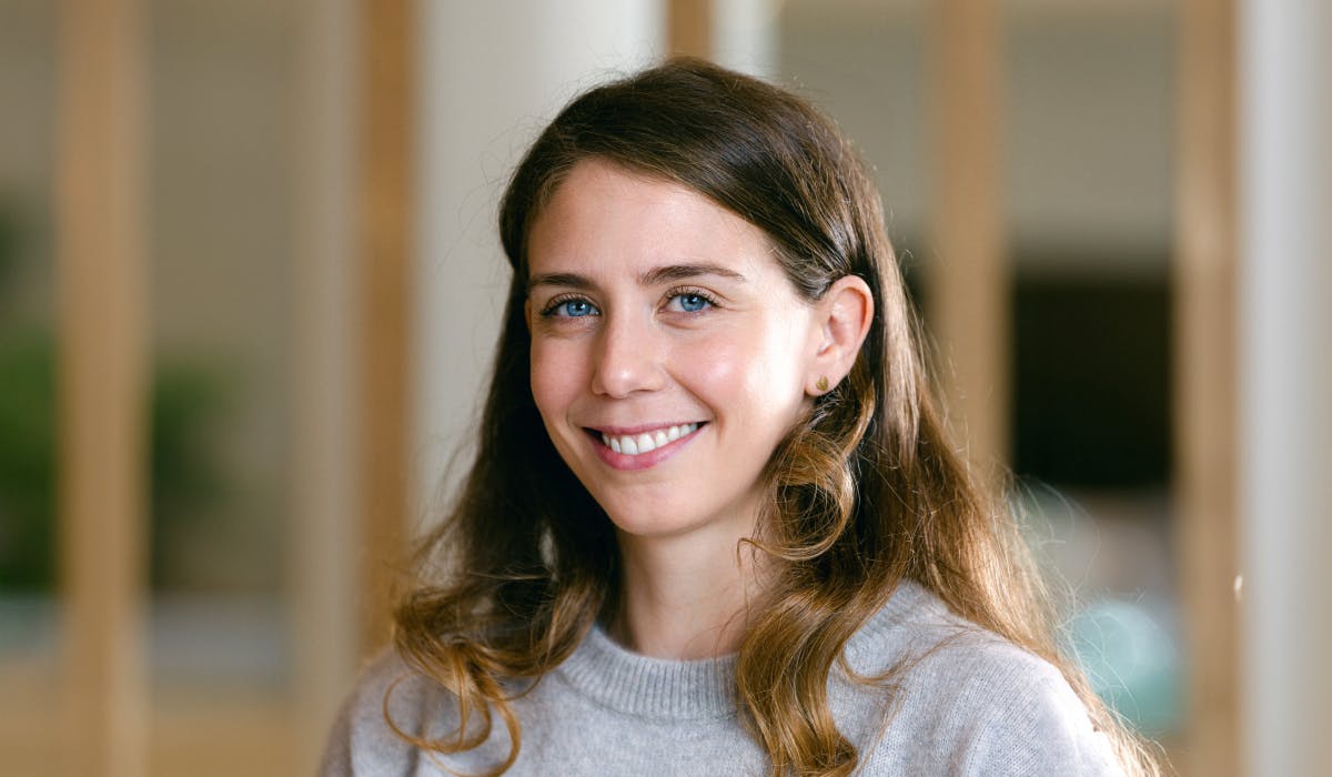 A photograph of a woman smiling.