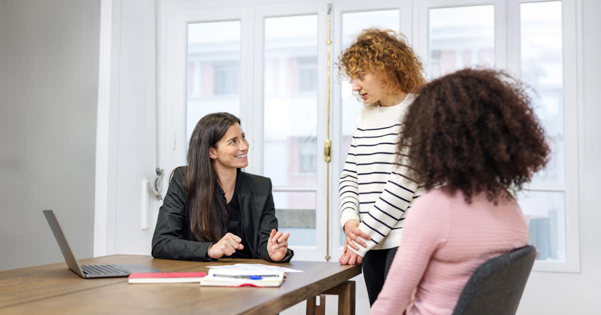 Team members talking together
