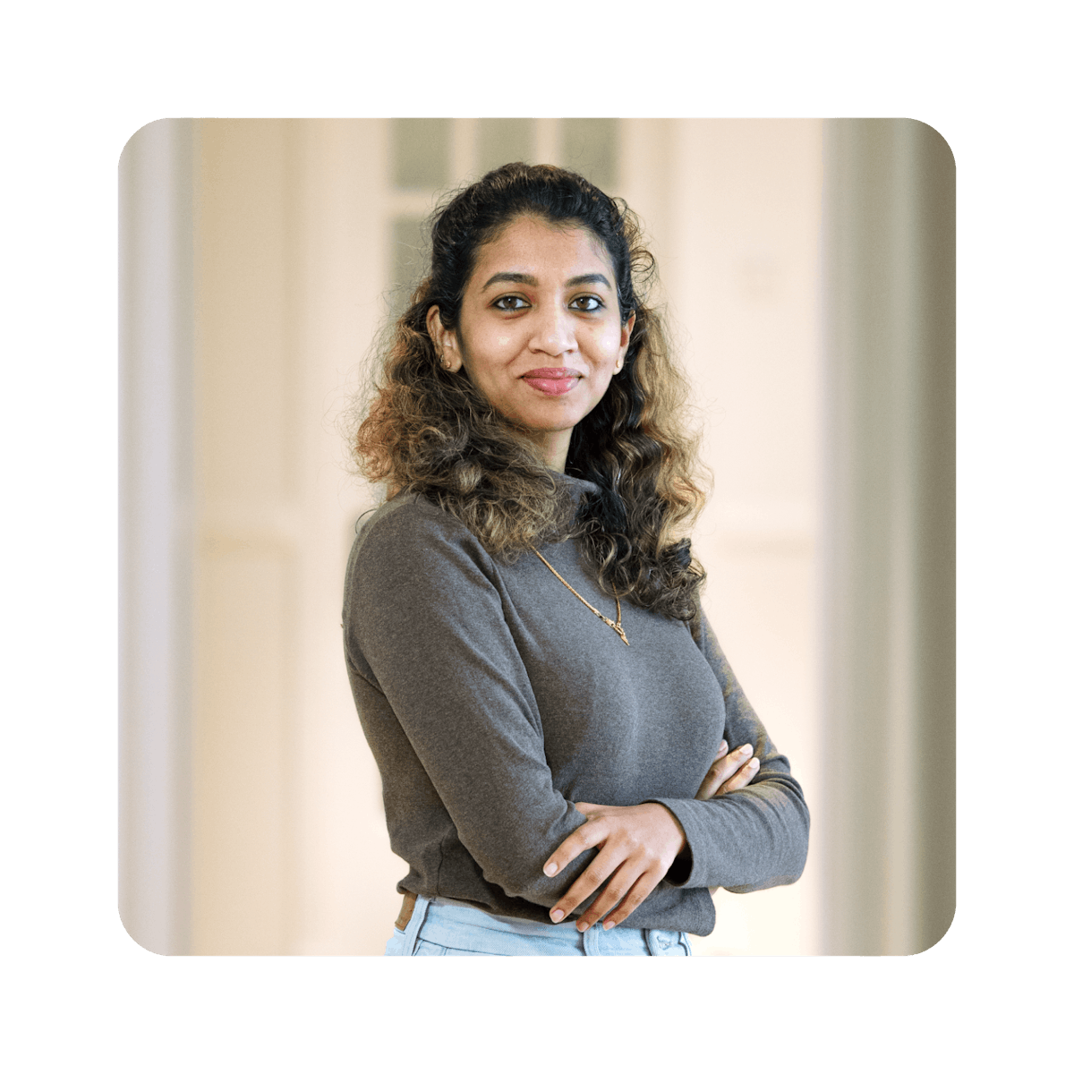 Woman smiling with arms crossed