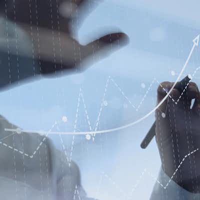 Man hovering over board with numbers