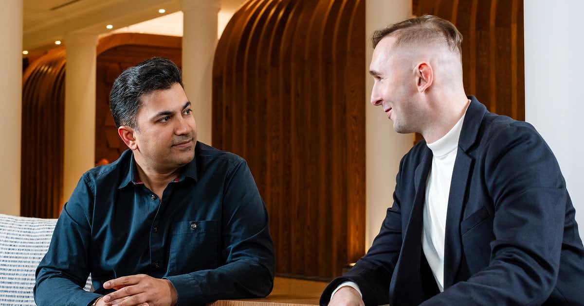 image with two men having a conversation