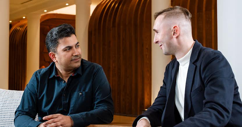 image with two men having a conversation