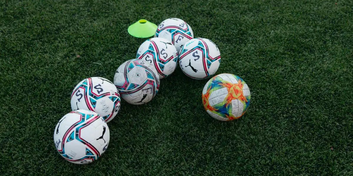 Footballs on a Pitch