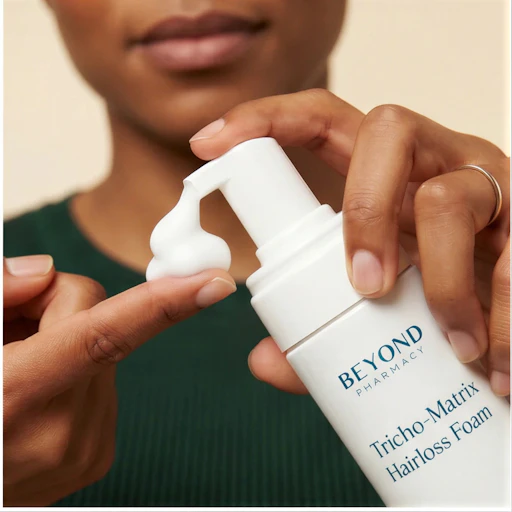 A lightweight Beyond hair-loss foam being dispensed