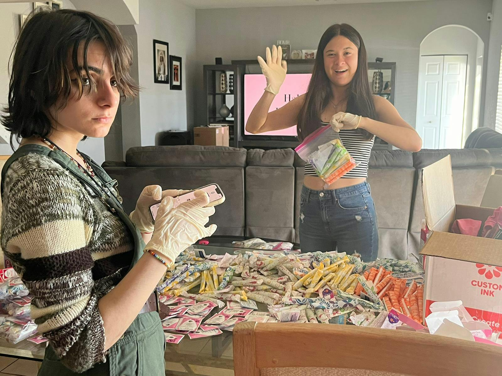 Volunteers help pack up period products