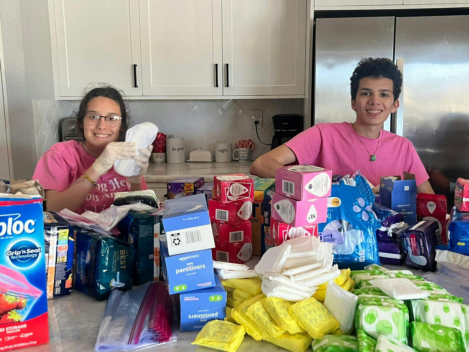 Volunteers help pack up period products
