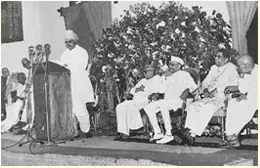 Delivering a speech in the august presence of K. Kamaraj, M. Bhaktavasalam, H. E. Sri Sri Prakasa - Governor of Madras and C. Rajagopalachari, 1958