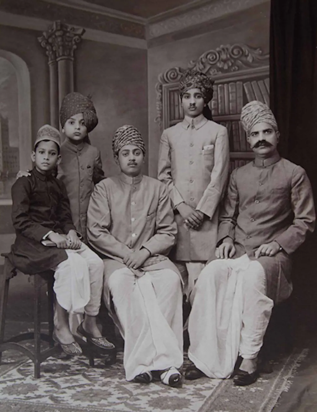 Young Milapchand (second from left) with his father Lalchand and brother-in-law Manoharchand Golechha (center)