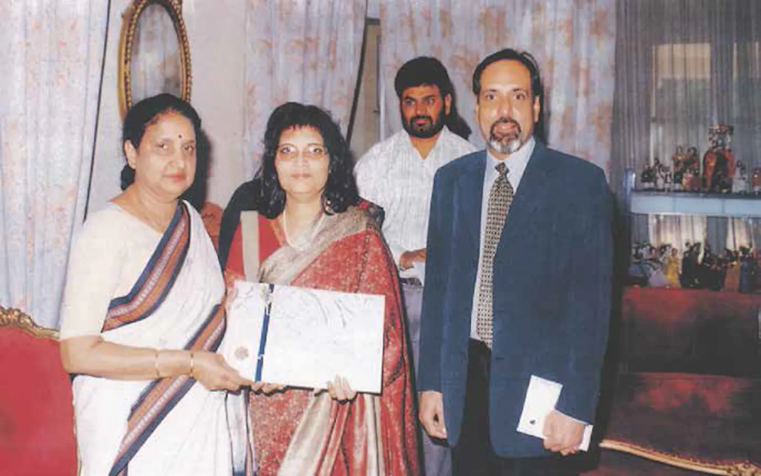 Madhu & Maher presenting Rama Devi, Governor of Karnataka with Dukan's Newsletter at the Raj Bhavan