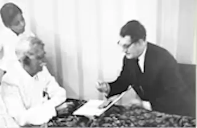 S. Lalchand Dadha with Mr. E.B.Ward, Chairman, Ward Blerkinsop Ltd, at the signing of transfer of business to Dadha & Co (grandson Maher is in the background)