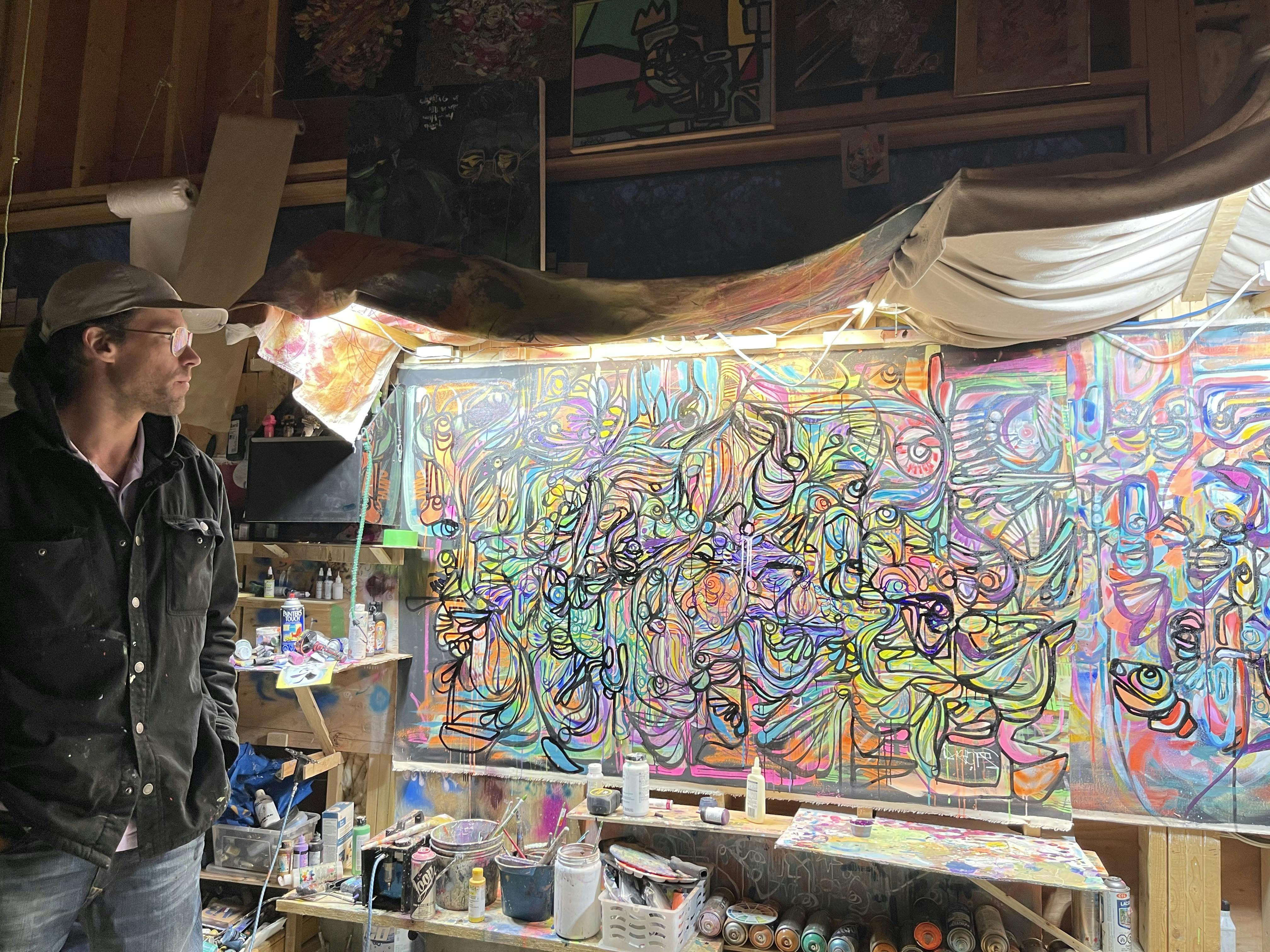 Doktoer contemplating a work in progress at his United Universal Collective Studio.