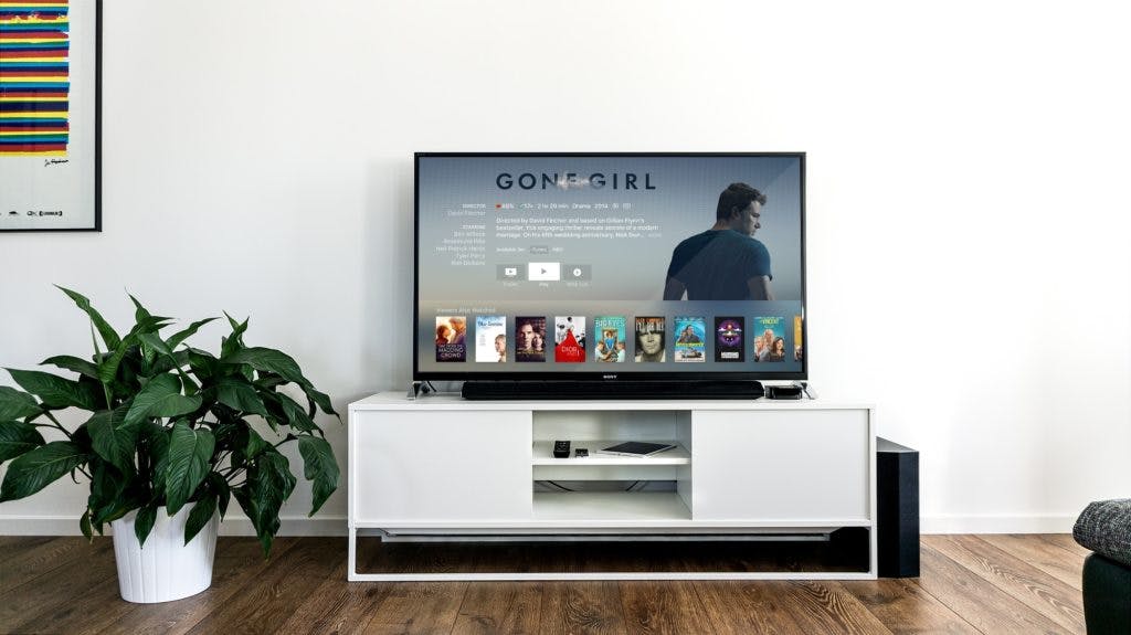 A TV displaying a netflix show "Gone Girl"
