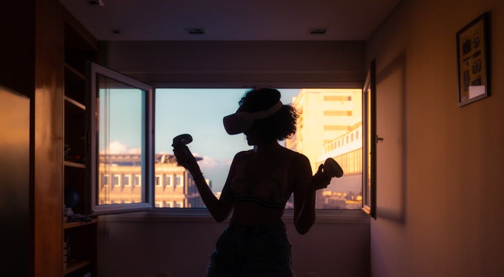 silhouette of a woman wearing a VR headset