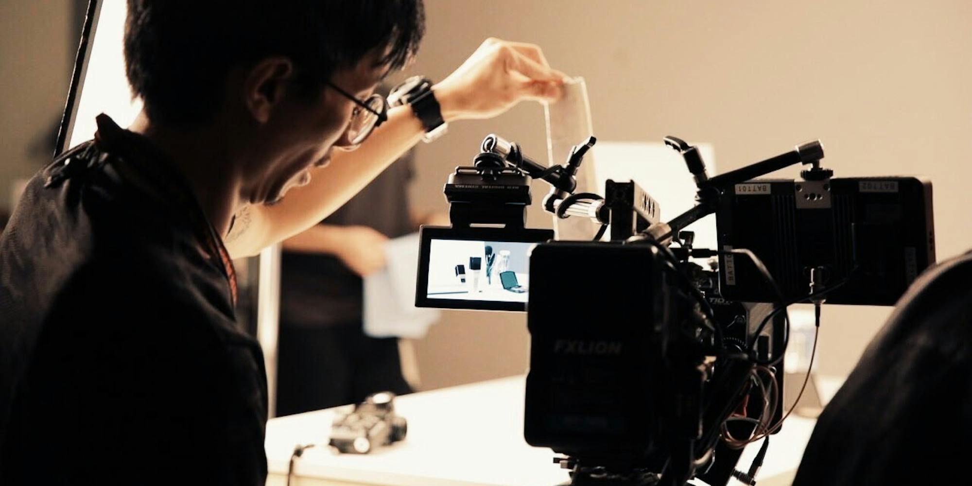 Guy filming a product shoot