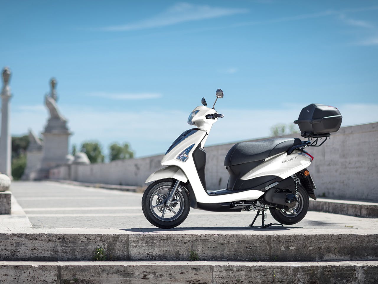 Yamaha D'elight 125 scooter in Milky White parked on street