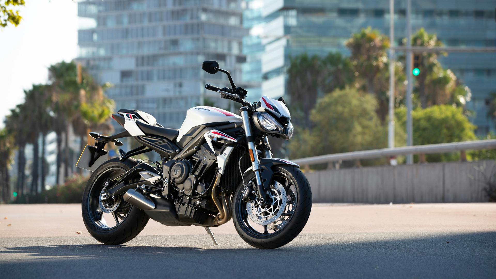 Triumph Street Triple S in crystal white colour, parked.